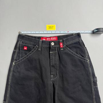 Front of the jorts with a tape measure